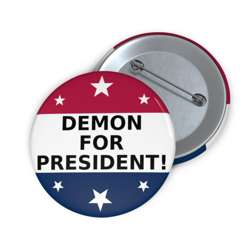An image of the "Demon for President!" political pin, as designed by Owen Tyme to help promote his novel, Demon for President!