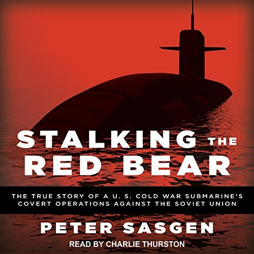 An audio book cover featuring a modern submarine in black on a red background and the title Stalking the Red Bear and subtitles in white letters along with the author's name and narrator in white letters as well.