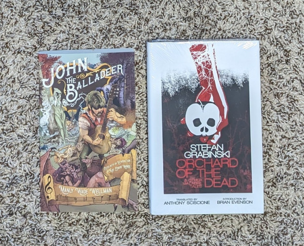 Paperback of JOHN THE BALLADEER by Manly Wade Wellman & Hardcover of ORCHARD OF THE DEAD by Stefan Grabinski
