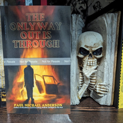 Paperback of THE ONLY WAY OUT IS THROUGH by Paul Michael Anderson. A human-like form with glowing eyes stands in front of a burning automobile as the flames reach towards the sky.