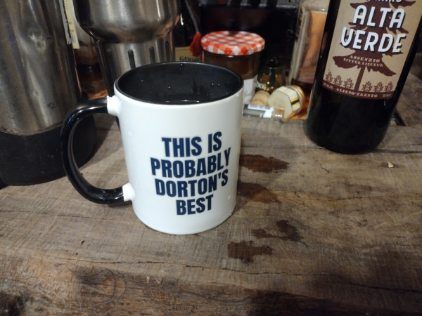 Back of a shuttlepod mug that says "THIS IS PROBABLY DORTON'S BEST"

I nether confirm nor deny it contains Dorton's Best