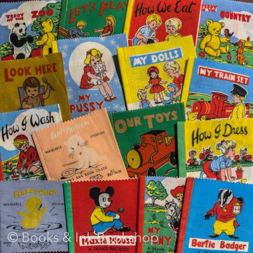 Face out display of brightly coloured cloth or rag books for babies and young children.