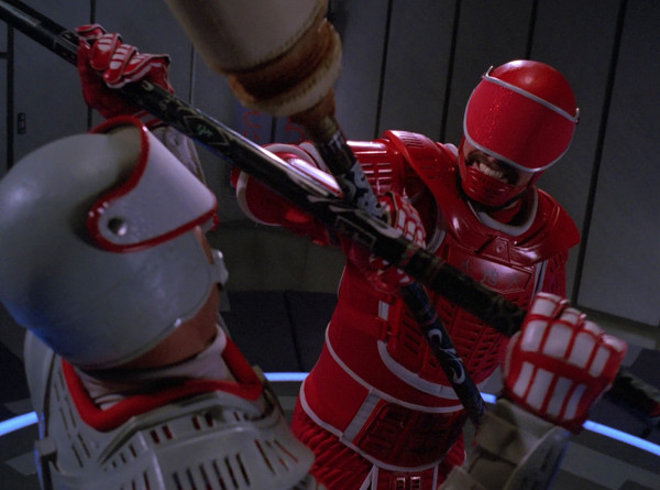Riker and his father battling in futuristic martial arts