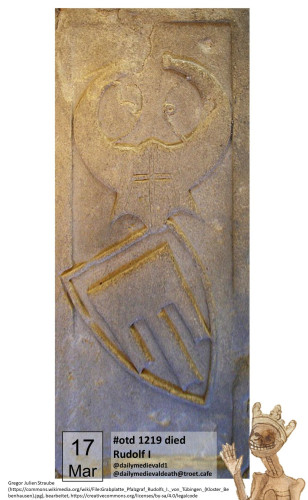 The picture shows a tomb slab with a helmet and a shield