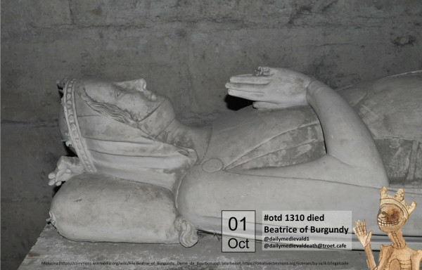 The picture shows the head and upper body of a reclining figure made of white stone with folded hands in front of the chest