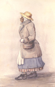 A woman dressed in the clothing of the late 1700s and early 1800s 