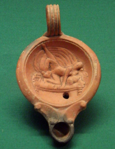 Roman terracotta oil lamp depicting a woman giving cunnilingus to another woman.