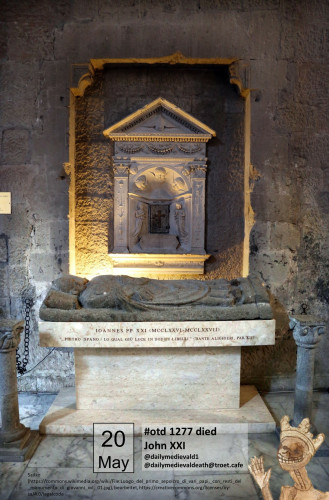The picture shows a tomb with a reclining figure made of stone.