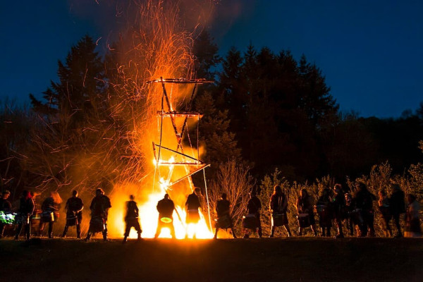 A shot from Butser Ancient Farm's Beltain Celtic Fire Festival 2019. The wickerman has burnt away to just the bare bones, and Pentacle Drummers are performing in front of the remains of the bonfire.

Wikimedia Commons: https://commons.wikimedia.org/wiki/File:Beltain_Wickerman_Bonfire_with_Drummers.jpg