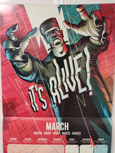 A picture of a calendar page that shows the month of March.

The calendar image shows an image of Frankenstein's monster with his arms raised in a terrifying gesture. The drawing has a comic book style.

In the center of the image appears the phrase "IT'S ALIVE!"