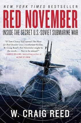 Book cover featuring a submarine in turbulent water with the title in large red letters "Red November" followed by the subtitle below it in small black letters "Inside the Secret US-Soviet Submarine War." The author's name is in white letters at the bottom of the cover. W Craig Reed