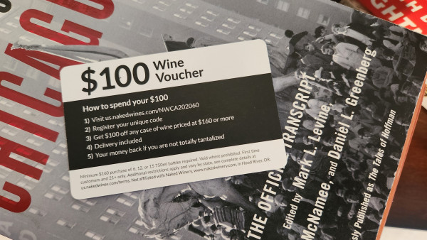 A $100 wine voucher card naked wines that was inside a used book