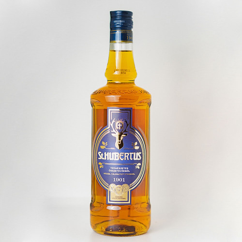 a bottle of hungarian liquor called "St. Hubertus" with a logo featuring a Stag head with a holy cross between its antlers