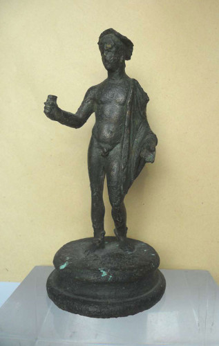 Bronze figurine of Hermes-Mercurius. The god is dressed in a short traveller's cloak, sandals, and a hat. He used to hold his kerykeion staff of which now only the part just above and below his hand remains.