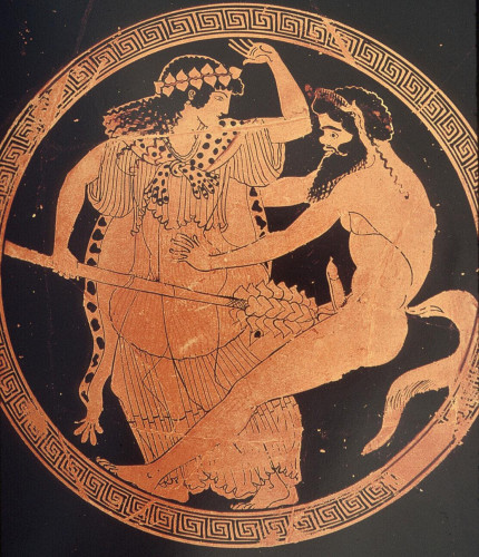 A maenad fighting off a horny satyr by pushing her thyrsos staff against his genitals and raising her hand as if to slap.