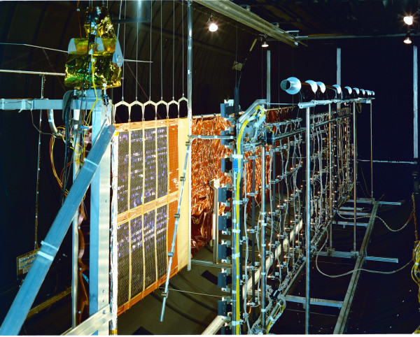 Square color photograph. National Aeronautics and Space Administration. John H. Glenn Research Center at Lewis Field.
COMMUNICATION TECHNOLOGY SATELLITE CTS SPA SOLAR PANEL ASSEMBLY
Bright yellow, orange, red, gold and aqua blue color are all present in this photo in the framings, panels, wiring of this comm satellite of NASA.