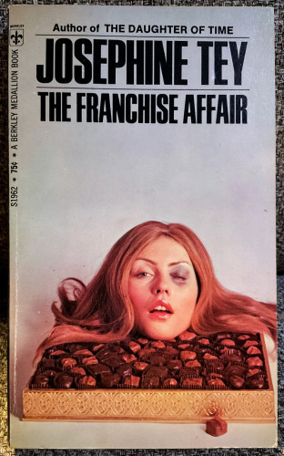 On top of a box of mixed chocolates rests the head of a red-haired woman with a black eye.

JOSEPHINE TEY
THE FRANCHISE AFFAIR