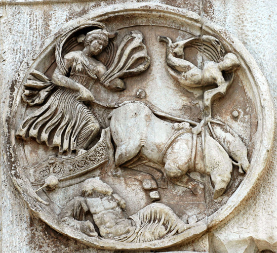 Marble relief of Luna descending in her chariot, about to dive into the waters of Okeanos who is shown as a reclining male figure at the bottom of the round frieze. Above the chariot, a little figure is flying, possibly Eros or a star.