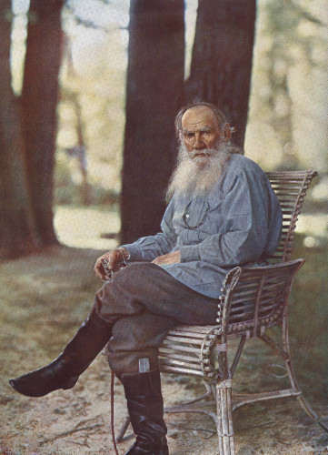 Tolstoy on 23 May 1908 at Yasnaya Polyana,[44] Lithograph print by Sergey Prokudin-Gorsky. Tolstoy has a long gray beard, light blue shirt and boots. By Sergei Prokudin-Gorskii - http://vm1.culture.ru/gosudarstvennyy_muzey_tolstogo/catalog/0003600108/, Public Domain, https://commons.wikimedia.org/w/index.php?curid=2324270