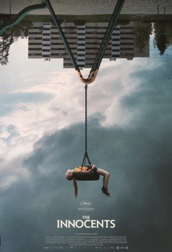 Movie poster for THE INNOCENTS: An upside down scene of an apartment building is shown with a young girl dangling in the air, lying on a tire swing