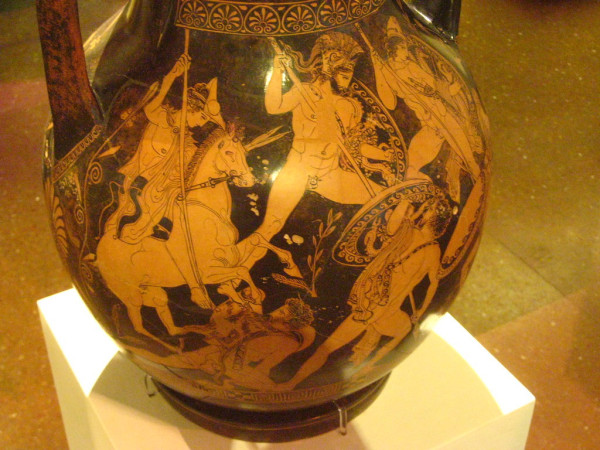 Red-figure vase painting of Ares and the Dioskouroi Kastor and Polydeukes. The artist shows Ares in heroic nudity with just a crested helmet and aspis shield attacking the Titans with a spear, whose backs are turned to us: having their backs turned was a major innovation of this vase painting.